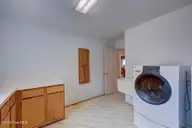 112 Coastal Bluffs Court, Hampstead, NC 28443 — 4-bedroom waterfront home in Olde Point, Hampstead, NC, photo 23 of 37: Large Laundry Room