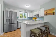 300 Mcginnis Drive, Pine Knoll Shores, NC 28512 — 3-bedroom waterfront condo in Mcginnis Point, Pine Knoll Shores, NC, photo 14 of 57: Kitchen Bar