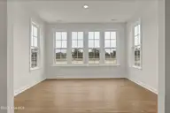 201 Planters Walk, Hampstead, NC 28443 — 4-bedroom waterfront home in East Wynd, Hampstead, NC, photo 10 of 33: Sunroom