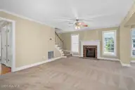 4204 Fairhaven Drive, Rocky Mount, NC 27803 — 4-bedroom home in Fairfield, Rocky Mount, NC, photo 7 of 30: Fireplace anchors the space