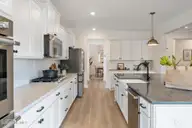 6711 Fellowship Drive, Leland, NC 28451 — 5-bedroom home in Grand Park, Leland, NC, photo 22 of 49: Kitchen to Dining Room - Yates II B - Fo