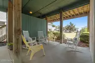 3 Juniper Court, Ocean Isle Beach, NC 28469 — 5-bedroom home in Island Park, Ocean Isle Beach, NC, photo 5 of 54: Lower outdoor living space