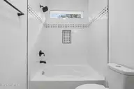 147 Creek Bend Drive, Vass, NC 28394 — 2-bedroom home in Riverview Acres, Vass, NC, photo 12 of 32: Tile Bathtub