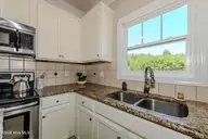 673 Morris Landing Road, Holly Ridge, NC 28445 — 3-bedroom home in The Preserve At Morris Landing, Holly Ridge, NC, photo 19 of 76: Kitchen