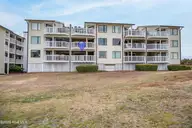 10300 Coast Guard Road E103, Emerald Isle, NC 28594 — 3-bedroom waterfront condo in Point Emerald Villas, Emerald Isle, NC, photo 2 of 47: Back of condo