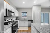 5017 Northstar Drive, Leland, NC 28451 — 3-bedroom townhome in Bishops Ridge, Leland, NC, photo 17 of 51: 17_kitchen