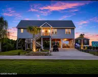 7120 Canal Drive, Emerald Isle, NC 28594 — 4-bedroom waterfront home in Archers Point, Emerald Isle, NC, photo 1 of 43: Front of Home