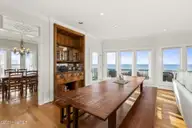 3107 Ocean Drive, Emerald Isle, NC 28594 — 6-bedroom waterfront home in Emerald Isle By The Sea, Emerald Isle, NC, photo 13 of 59: Open living room w/ fireplace