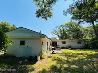 117 Juniper Road, Pine Knoll Shores, NC 28512 — 3-bedroom home in Piksco, Pine Knoll Shores, NC, photo 5 of 33: Back view