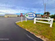 Ocean Sands, Atlantic Beach — 1-bedroom waterfront condo in Ocean Sands, Atlantic Beach, NC, photo 3 of 40: PAVING & SIGN