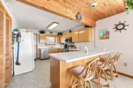 214 E Boardwalk Boulevard, Atlantic Beach, NC 28512 — 3-bedroom waterfront home, Atlantic Beach, NC, photo 15 of 55: Kitchen Bar