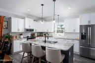 541 Moss Lake Lane, Holly Ridge, NC 28445 — 4-bedroom home in Summerhouse On Everett Bay, Holly Ridge, NC, photo 16 of 71: kitchen-01b