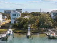452 N Anderson Boulevard, Holly Ridge, NC 28445 — 3-bedroom waterfront home, Holly Ridge, NC, photo 2 of 4: 9-web-or-mls-DJI_20241213114626_0761_D