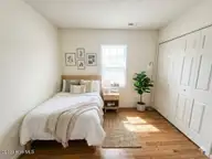 243 Parnell Road, Hubert, NC 28539 — 3-bedroom home in Foxtrace, Hubert, NC, photo 23 of 26: Bedroom 2 AI Staged