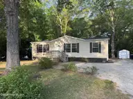 407 Maple Street SW, Shallotte, NC 28470 — 2-bedroom manufactured home in Lakewood Estates, Shallotte, NC, photo 3 of 26: front yard 2