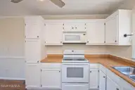 915 Sunset Boulevard, Newport, NC 28570 — 3-bedroom waterfront home in Sound View Park, Newport, NC, photo 23 of 55: Kitchen V2