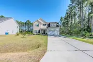 107 Village Drive, Holly Ridge, NC 28445 — 4-bedroom home in Coastal Village, Holly Ridge, NC, photo 4 of 77: Front
