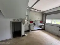 118 Oakwood Drive, Havelock, NC 28532 — 4-bedroom home, Havelock, NC, photo 17 of 56: Garage 2side