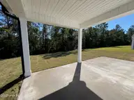 6275 Raystone Way 121, Leland, NC 28451 — 3-bedroom home in Pinewood, Leland, NC, photo 5 of 27: Covered Patio