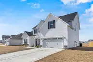 646 Indigo Johnston Drive, Jacksonville, NC 28546 — 5-bedroom home in Onslow Bay, Jacksonville, NC, photo 2 of 54: 2_front exterior