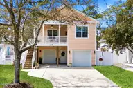 135 NE 75th Street, Oak Island, NC 28465 — 4-bedroom home in Tranquil Harbor, Oak Island, NC, photo 2 of 37: Front