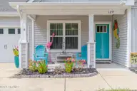 129 NE 13th Street, Oak Island, NC 28465 — 3-bedroom home, Oak Island, NC, photo 4 of 68: Front Porch Area