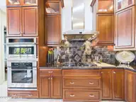 8900 Mahogany Run, Wilmington, NC 28411 — 3-bedroom home in Porters Neck Plantation, Wilmington, NC, photo 17 of 75: 27-web-or-mls-28_STILL076_kitchen-range-