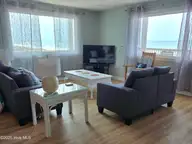 1103 Ocean Drive E & W, Emerald Isle, NC 28594 — 6-bedroom waterfront home, Emerald Isle, NC, photo 11 of 65: living room