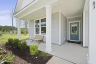 2013 Brisco Way 4, Leland, NC 28451 — 3-bedroom home in Brunswick Forest, Leland, NC, photo 3 of 36: Front Porch
