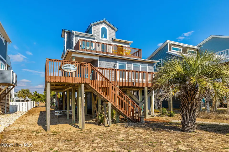 318 E Beach Drive, Oak Island, NC 28465 — 4-bedroom waterfront home, Oak Island, NC, photo 1 of 80