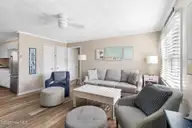 902 Ocean Drive E&W, Emerald Isle, NC 28594 — 4-bedroom home in Emerald Isle By The Sea, Emerald Isle, NC, photo 15 of 45: Living Room - East Side