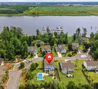 13009 Bending River Way, Leland, NC 28451 — 4-bedroom waterfront home in Hawkeswater at the River, Leland, NC, photo 1 of 69: 13009_bending_river_wy_064