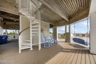 233 Sea Dreams Drive, Atlantic Beach, NC 28512 — 3-bedroom home in Sea Dreams, Atlantic Beach, NC, photo 12 of 68: shaded area at pool-under clubhouse