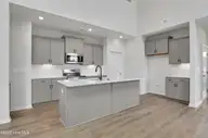 3048 Coastal Dream Way, Leland, NC 28451 — 4-bedroom townhome in Grand Park, Leland, NC, photo 5 of 39: Kitchen