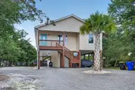 140 NE 18th Street, Oak Island, NC 28465 — 3-bedroom waterfront home, Oak Island, NC, photo 1 of 53