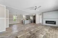 6830 Lewis Drive SE, Winnabow, NC 28479 — 3-bedroom manufactured home in Lewis Acres, Winnabow, NC, photo 6 of 29: Living room