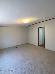 1951 Stanley Road SW, Supply, NC 28462 — 4-bedroom manufactured home, Supply, NC, photo 12 of 27: Mstr Bedrm 2