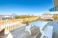 1131 S Shore Drive, Surf City, NC 28445 — 4-bedroom waterfront home in Horse Hammock, Surf City, NC, photo 22 of 40: Top Floor Poolside Sundeck