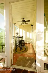 103 Spanish Moss Court, Hampstead, NC 28443 — 3-bedroom home in Forest At Belvedere, Hampstead, NC, photo 24 of 28: Sunroom view 2