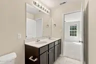 131 Beacon Woods Drive, Holly Ridge, NC 28445 — 2-bedroom townhome in The Townes At Holly Ridge, Holly Ridge, NC, photo 18 of 38: Primary Bedroom Bath