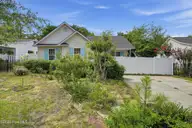 121 NE 6th Street, Oak Island, NC 28465 — 3-bedroom home in Tranquil Harbor, Oak Island, NC, photo 2 of 21: Front