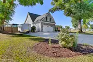 135 Darel Street, Rocky Point, NC 28457 — 4-bedroom waterfront home in Brick Chimney Landing, Rocky Point, NC, photo 3 of 72: Front