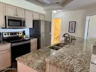 330 S Middleton Drive NW Unit 505, Calabash, NC 28467 — 2-bedroom waterfront condo in Brunswick Plantation, Calabash, NC, photo 11 of 72: 505 kitchen granite countertops