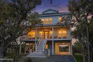 109 Old Village Lane, North Topsail Beach, NC 28460 — 8-bedroom waterfront home in The Village of Stump Sound, North Topsail Beach, NC, photo 1 of 73: 109OldVillage_Front_01_Dusk_02