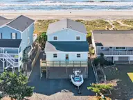 877 Ocean Boulevard W, Holden Beach, NC 28462 — 5-bedroom waterfront home in Colonial Beach, Holden Beach, NC, photo 3 of 63: 80-kahunaphoto