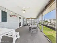117 Salisbury Street, Holden Beach, NC 28462 — 3-bedroom waterfront home, Holden Beach, NC, photo 22 of 40: Screen Porch