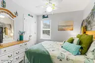 124 NE 15th Street, Oak Island, NC 28465 — 3-bedroom home in Long Beach, Oak Island, NC, photo 18 of 51: thumbnail-0196a7bd-01a8-73b8-9272-781a27