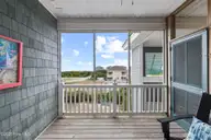 112 Oakleaf Drive 1003-A, Pine Knoll Shores, NC 28512 — 2-bedroom waterfront condo in Shutters OS, Pine Knoll Shores, NC, photo 10 of 58: Front Balcony (a)