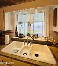 1008 Bateman Drive, Elizabeth City, NC 27909 — 4-bedroom waterfront home in Bateman Estates, Elizabeth City, NC, photo 17 of 74: Farm sink over looking the water front!