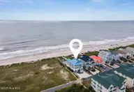 349 W First Street, Ocean Isle Beach, NC 28469 — 6-bedroom waterfront home in Islander Resort, Ocean Isle Beach, NC, photo 6 of 74: Screen Shot 2025-04-01 at 2.40.22 PM